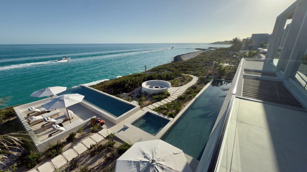 Clifftop villa with two pools above a turquoise sea